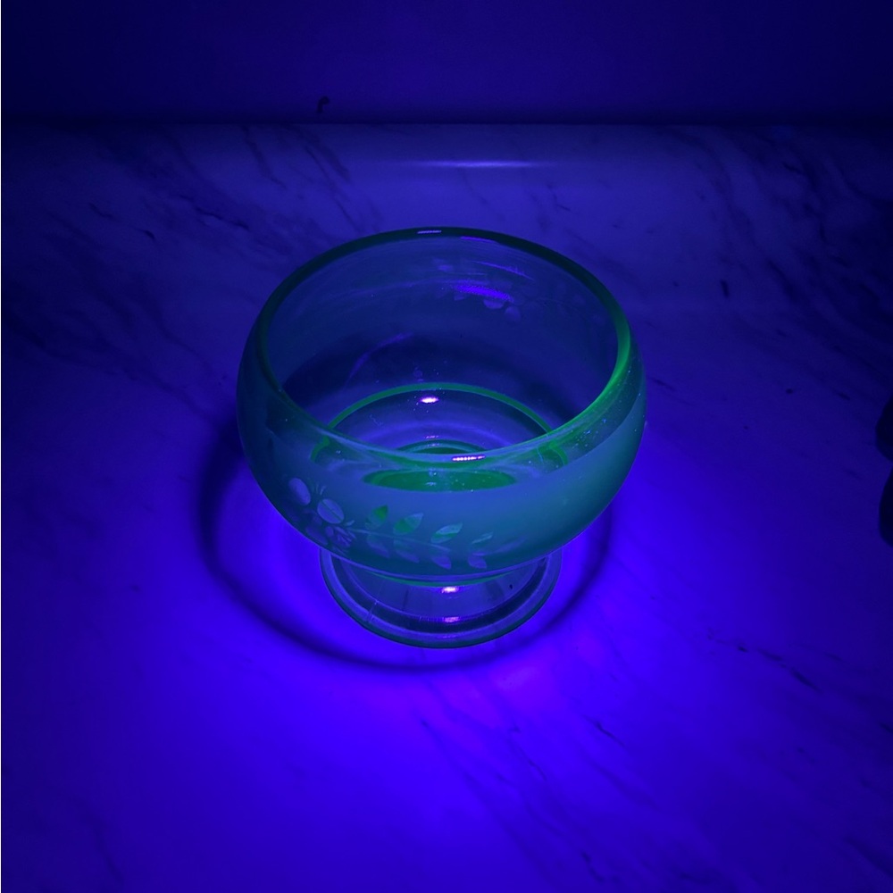 Vintage green etched depression glass bowl/ candy dish has a light glow under UV